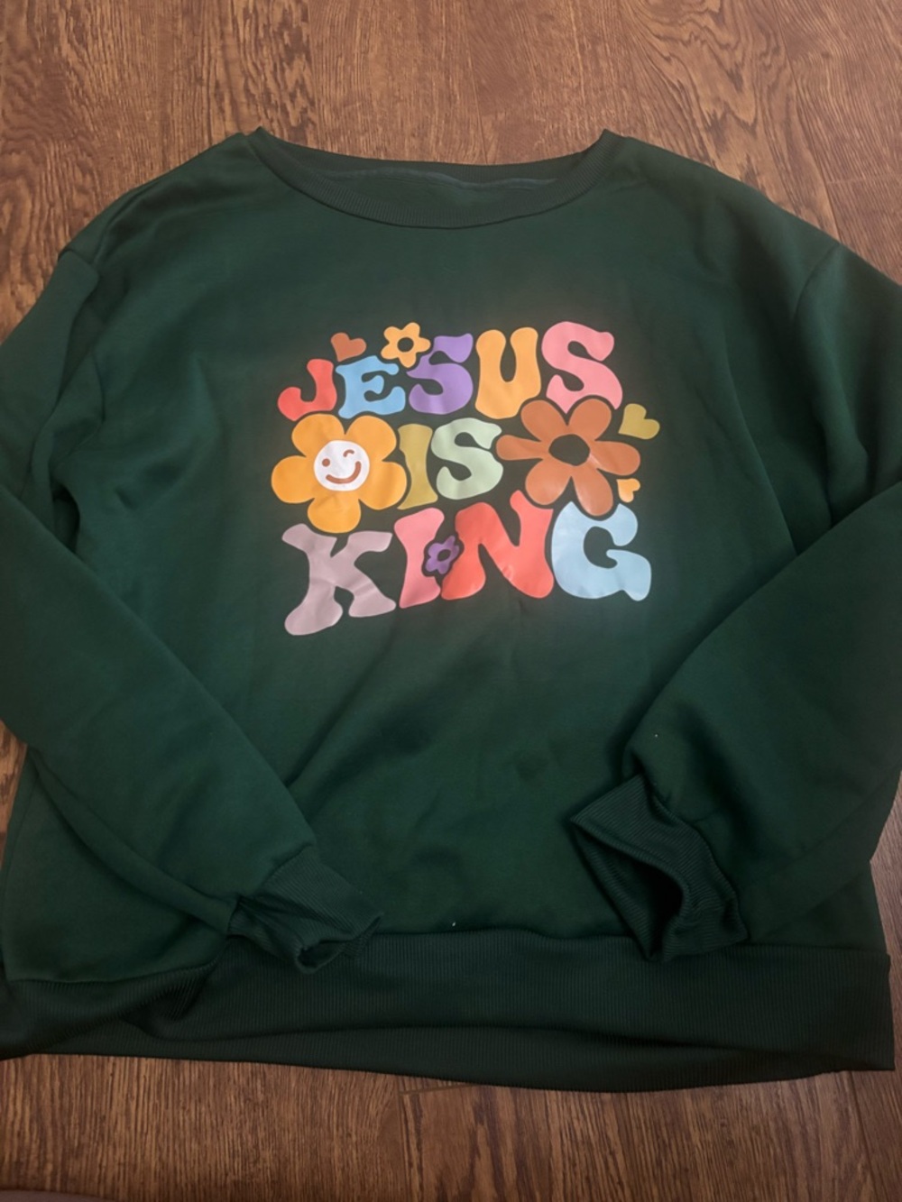 Green Sweatshirt with Colorful "Jesus Is King" Graphic